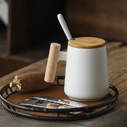 White mug with wooden handle and lid on a wooden tray