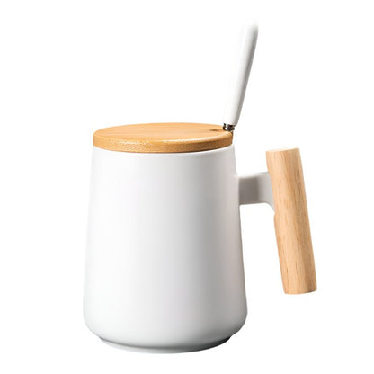 White mug with a wooden lid and handle on a white background