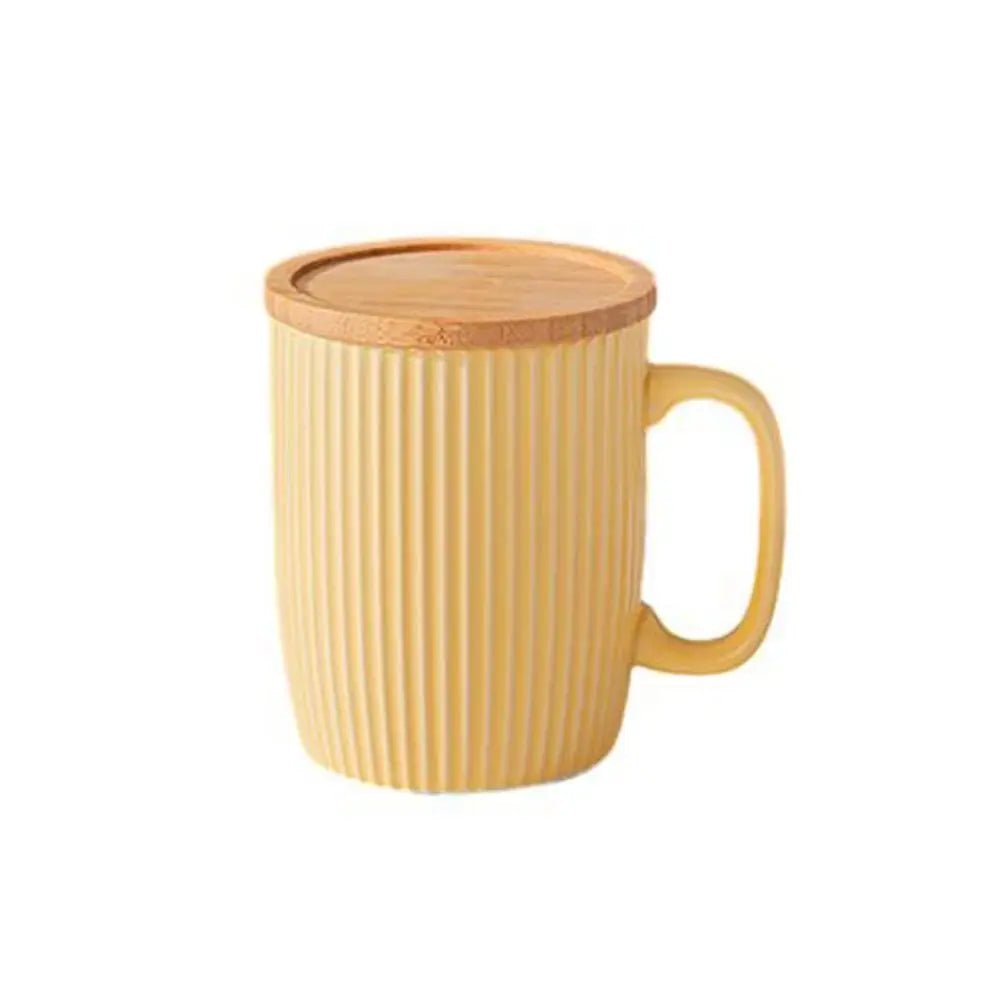 Yellow mug with a wooden lid on a white background