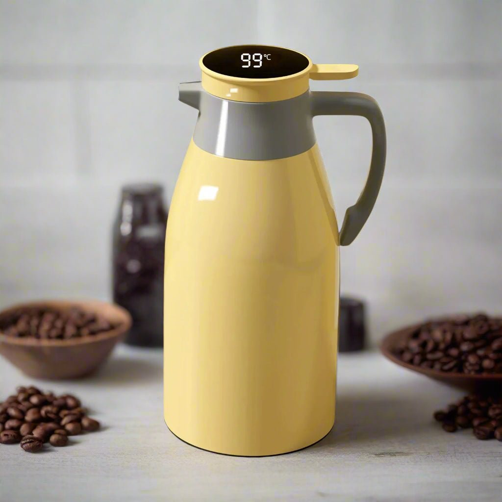Yellow thermos with digital temperature display on a surface with coffee beans